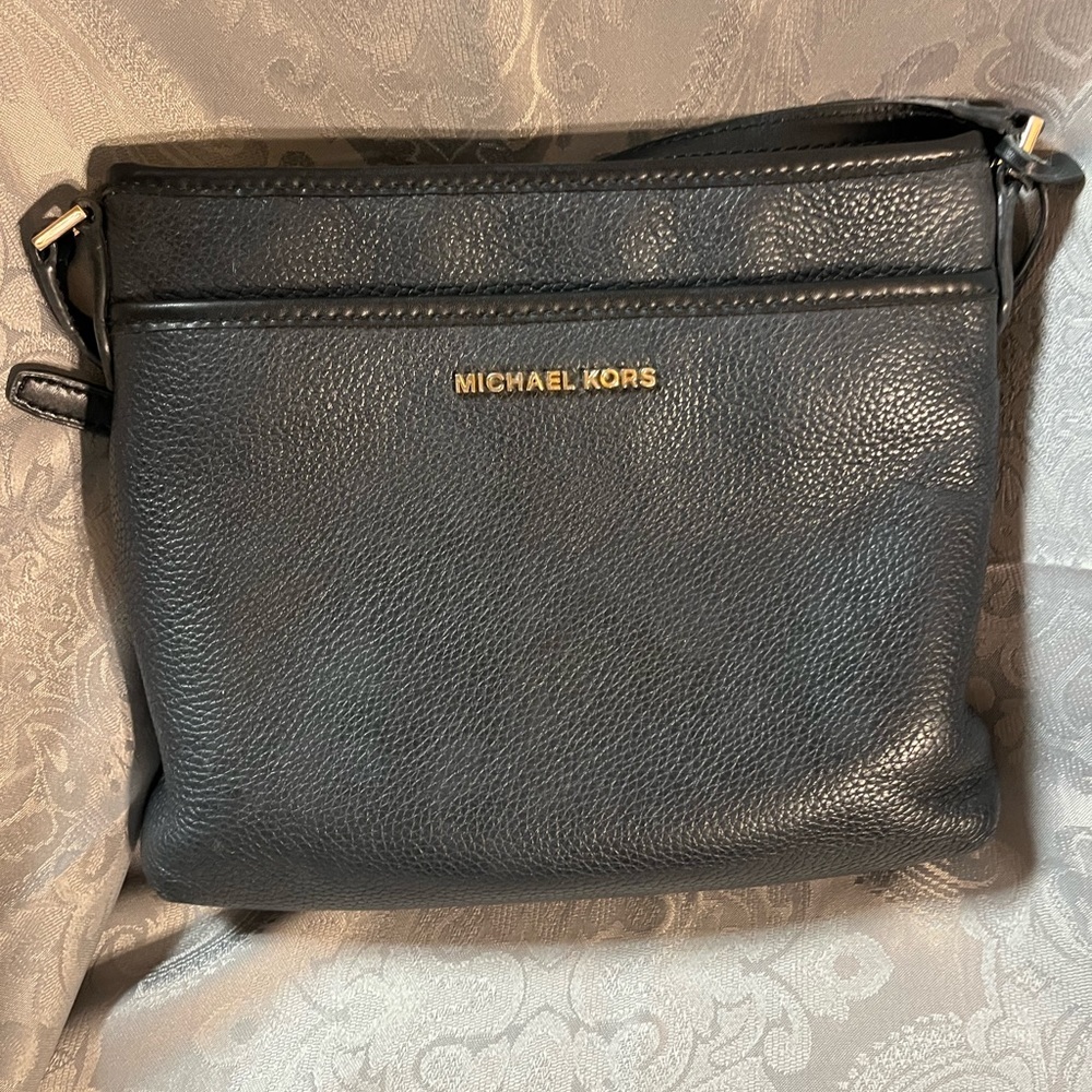 Michael Kors Black bag w/adjustable strap and gold accents